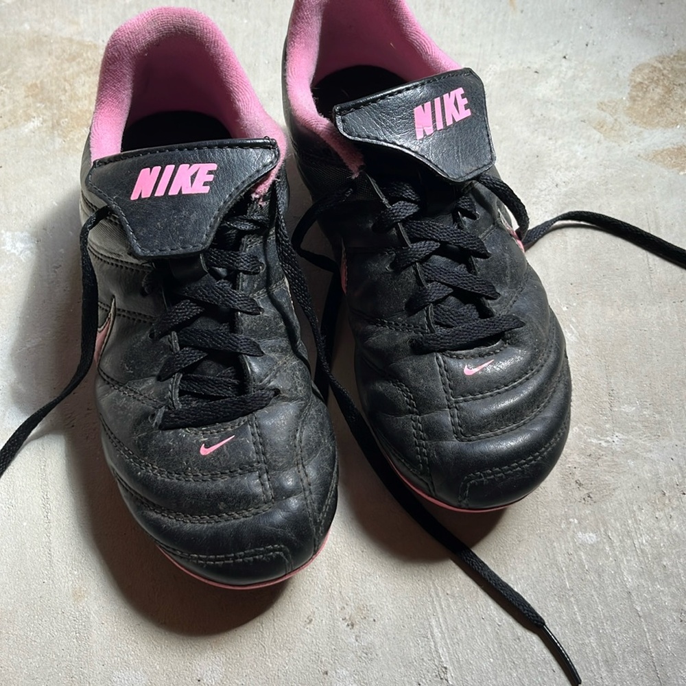 Nike Kids Black Cleats with Pink Highlights